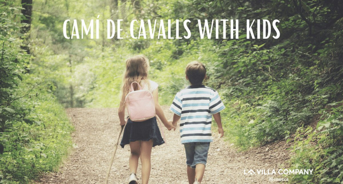 Two young children walking hand in hand on a forest trail along the Camí de Cavalls in Menorca, ideal for family adventures from nearby holiday villas.